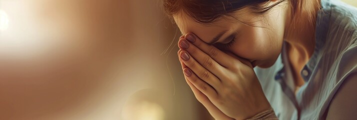 religious Woman praying with her hands clasped with plenty of copy space