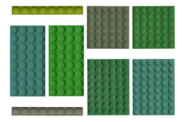 vintage plastic brick plate set isolated. old toy surface style background. pattern of military colo