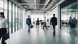 © rouda100 - Bright workplace office with people walking blur