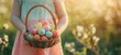 A child holding an Easter egg basket filled with pastel colored eggs, symbolizing the festive spirit of dyed easter eggs for kids.