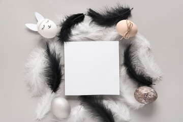 Sticker - Feathers, decorated Easter eggs and empty paper sheet on grey background