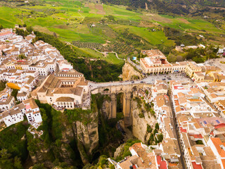 Wall Mural - Aerial view of Ronda landscape and buildings with Puente Nuevo Bridge, Andalusia, Spain