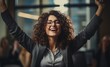 © Денис Никифоров - Image Showing a Delighted Female Employee Expressing Happiness and Smiling with Raised Arms in Response to a Company Triumph or Accomplished Project
