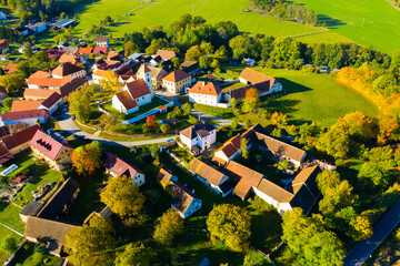 Wall Mural - Autumnal aerial landscape of czech village Cakov with Church of Saint Leonard in autumn day