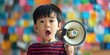 Asian kid with megaphone