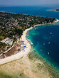 Aerial view of a port and coral reef on the coast of a small tropical island in Indonesia (Gili Islands, Lombok)
