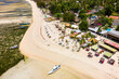 Aerial view of small tourist resorts and sunshades on a tropical island (Gili Air, Lombok, Indonesia)