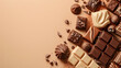 Top view of pieces of chocolate bar with chocolate chips and chocolate cake on light brown background with copy space
