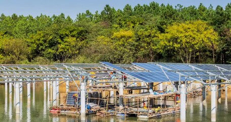 Poster - time-lapse of the photovoltaic solar panel installation site closeup on water, fishery-solar complementary power engineering scene