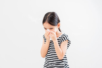 Little asian kid girl with allergy sneezing