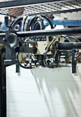Poster - Factory, machine and closeup on technology for production system in manufacturing warehouse. Industrial, process and printing press with metal on wall for construction or development in productivity