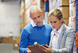 © T. Rose/peopleimages.com - Writing, clipboard or business people at warehouse for logistic, delivery or cargo, shipping or planning. Factory, supply chain or managers with paper checklist for retail, stock or procurement notes