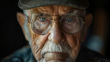 Portrait of wrinkled army war veteran looking directly into the camera.
