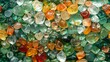  A detailed photograph of various colored glass fragments arranged in a haphazard stack, exhibiting diverse shapes and dimensions
