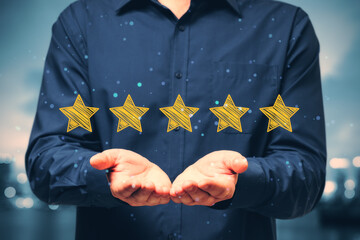Poster - Close up of businessman hand holding 5 star rating on blurry city background. Customer service and excellent feedback concept.