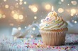 © Anns - Delicious birthday cupcake on table on light back