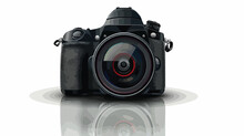 Digital SLR Camera DSLR With A Reflection On A Table