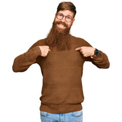 Wall Mural - Young irish redhead man wearing casual clothes and glasses looking confident with smile on face, pointing oneself with fingers proud and happy.