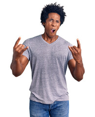 Sticker - Handsome african american man with afro hair wearing casual clothes shouting with crazy expression doing rock symbol with hands up. music star. heavy concept.