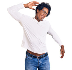 Poster - Handsome african american man with afro hair wearing casual clothes and glasses stretching back, tired and relaxed, sleepy and yawning for early morning