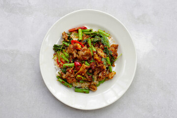 Wall Mural - Spicy stir fried pork and yard long bean with red curry paste. Thai food