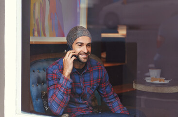 Leinwandbilder - Phone call, smile and man by cafe window for communication, conversation or networking. Happy, technology and male person talking for mobile discussion with cellphone in coffee shop or restaurant.