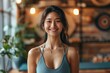 thai smiling happy female yoga instructor in a fitness studio, Generative AI