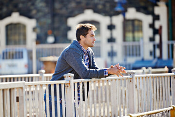 Poster - Decision, idea and man thinking outdoor in city for inspiration, question and daydreaming. Morning, thoughts and male person in winter clothing for trendy style, perspective and relax in urban town