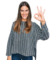 Canvas Print - Young beautiful woman wearing casual clothes smiling positive doing ok sign with hand and fingers. successful expression.