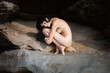 © misu - Young fully nude woman relaxing on sea sandy beach