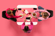 © Lustre Art Group  - Creative collage. Top view portrait of two young girl sitting at table eating and speaking against pink background. Concept of business lunch, morning meeting, briefing. Copy space. Ad