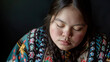 An Indigenous young woman with Down syndrome looking calm and peaceful, embodying serenity. Learning Disability