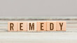 Word Remedy on wood cubes