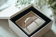 Elegant engagement ring in box with flowers