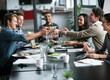 © YATrainer/peopleimages.com - People, lunch and share with workshop, meeting and collaboration for small business conference. Employees, startup food and management for teamwork, coaching and partnership for workforce project