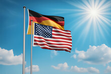 USA Und BRD Flagge Vor Blauem Himmel Im Wind Als Hintergrund