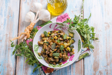 Wall Mural - sauteed eggplants witn garlic and mint leaf