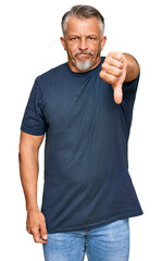 Canvas Print - Middle age grey-haired man wearing casual clothes looking unhappy and angry showing rejection and negative with thumbs down gesture. bad expression.