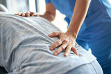 Fototapeta Panele - Physiotherapist's hands on patient's back during therapy session
