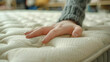 Choosing mattress and bed. Close up of female hand, generative ai