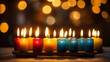 Group of blue yellow and red candles are lit in row.
