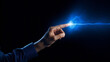 A human finger touching a spark of electrical energy illustrating a concept of power and connection.  Futuristic technology of information transfer