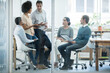© YATrainer/peopleimages.com - Employees, talking and office for meeting or planning for teamwork and profession in organisation. Diverse people or colleagues for discussion and career for employment and ideas for company indoor