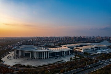 Wall Mural - Aerial shot of Tianjin Meijiang Convention and Exhibition Center, China at sunset