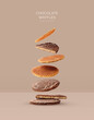 Creative layout made of chocolate stroopwafel on beige background. Flat lay. Food concept. Macro  concept.