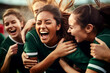 women female soccer football group of players celebrating a triumph win or winning a league, cup or tournament in a stadium by cheering in joy and punching the air elated in victory green kit