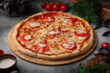 Wall Mural - Tomato and cheese pizza with spiced tomatoes and cheese on a grey table