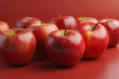 Red apples on a red background.