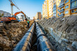 Laying underground pipes for urban heat supply and municipal sewer system