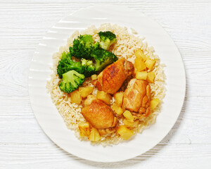 Wall Mural - chicken thighs with pineapple, rice and broccoli